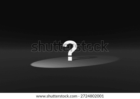 A three-dimensional question mark in the spotlight