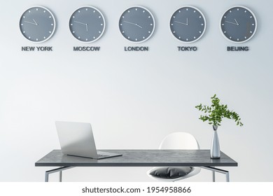 Time of world cities on wall clock in modern office space with dark marble table surface, laptop and green plane in glass vase, 3D rendering