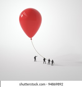 Tiny people holding a balloon - Powered by Shutterstock