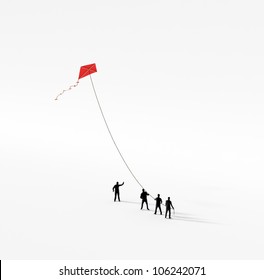 Tiny people holding a red kite - Powered by Shutterstock