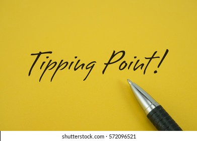 Tipping Point! Note With Pen On Yellow Background