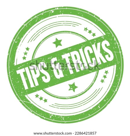 TIPS  TRICKS text on green round grungy texture stamp.