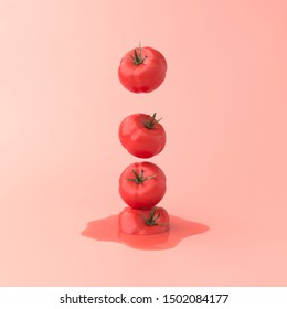 Tomatoes Falling Down In A Row On Pink Background. Abstract Vegetables Art. Minimal Food Concept. 3d Illustrations.