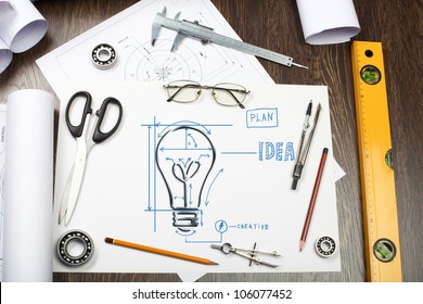Tools and papers on the table with industrial symbols