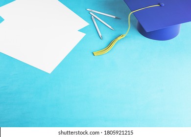 Top View Of Blue Graduation Cap And Paper On Table. Business And Education Concept. 3D Rendering