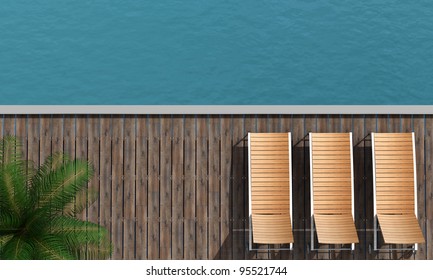 Top View Of  A Boardwalk With Three Beach Chair And Palm Tree