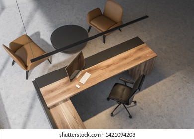 Top View Of CEO Office With Gray And Wooden Computer Table And Round Coffee Table With Leather Armchairs. 3d Rendering