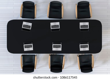 Top View Of A Conference Room. A Black Table, Six Chairs And Six Laptops. Office Interior. 3D Rendering.