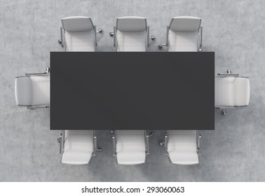 Top View Of A Conference Room. A Black Rectangular Table And Eight Chairs Around. 3D Rendering