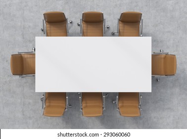 Top View Of A Conference Room. A White Rectangular Table And Eight Brown Leather Chairs Around. 3D Rendering