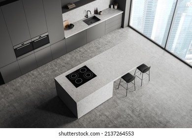 Top View Of Dark Cooking Interior With Bar Chairs And Countertop On Grey Concrete Floor, Sink With Kitchenware. Modern Kitchen With Panoramic Window On City View. 3D Rendering