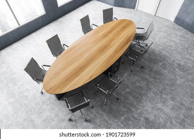 Top View Of Grey And Wooden Conference Room With Black Armchairs, Wooden Oval Table And Windows With City View. Meeting Room With Furniture On Marble Floor, 3D Rendering No People