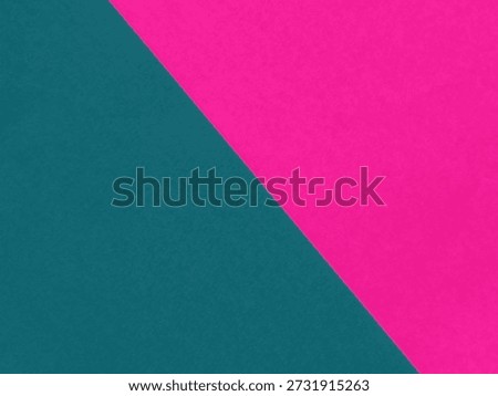 Top view of minimalist diagonal background featuring pink and dark teal textured paper with copy space.