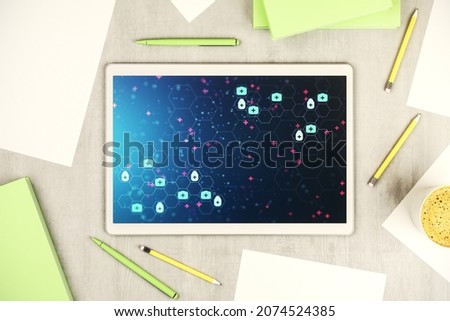 Top view of modern digital tablet monitor with creative abstract medical hologram. Healthcare technolody concept. 3D Rendering