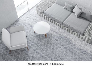 Top View Of Modern Living Room With White Walls, Concrete Floor, White Sofa And Armchair Near Round Coffee Table. 3d Rendering