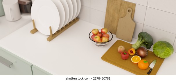 Top View, Modern White Kitchen Countertop Or Tabletop With Veggies And Fruits Slided On A Wood Chopping Board And Dish Organiser. 3d Rendering, 3d Illustration