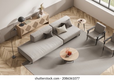 Top View On Bright Living Room Interior With Large Brown Sofa, Two Cozy Armchairs, Carpet, Pillows, Panoramic Window, Sideboard With Lamp, Books. Concept Of Comfortable Place For Meeting. 3d Rendering