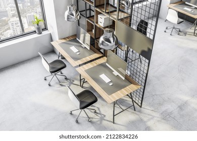 Top View On Spacious Work Places Background In Loft Interior Design Office With City View, Computers On Wooden Table Surfaces, Cozy Chairs, Stylish Chrome Lamps And Concrete Floor. 3D Rendering