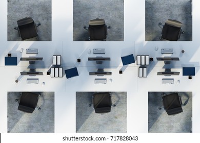 Top View Of Two Rows Of White Table Office Cubicles With Computers And Folders On The Desks. A Concrete Floor. Concept Of A Start Up. 3d Rendering Mock Up