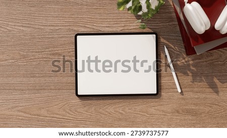 Top view of white screen tablet with stylus and headphones on books aside pot plant on wooden table. Product Display, 3D Rendering, 3D illustration.