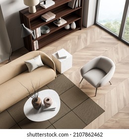 Top View Of Wooden Lounge Room Interior With Couch And Armchair, Coffee Table On Carpet And Parquet Floor, Panoramic Window On Countryside. Minimalist Guest Space, 3D Rendering