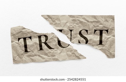 Torn paper with the word TRUST split in half, symbolizing broken trust. The crumpled texture emphasizes the fragility and loss of trust. Broken trust paper note.