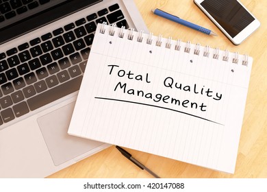 Total Quality Management - handwritten text in a notebook on a desk - 3d render illustration.