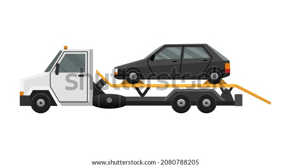 Tow truck. Flat faulty car loaded on a tow truck.
Vehicle repair service which provides assistance damaged or
salvaged cars