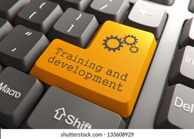 Training and Development, Orange Button on Computer Keyboard. Internet Concept.