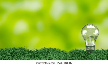 Transparent light bulb lying on fresh green grass symbolizing eco friendly energy sustainability renewable power environmental innovation and clean technology concept