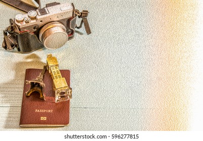 Travel Concept In Oil Paint Filter : Camera, Passport, Big Ben Model, Eiffel Tower Model , On Wooden Table, With Copy Space.