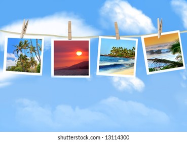 Travel Photos Hanging On A Clothes Line Against A Blue Sky