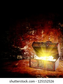 treasure chest with jewelry inside against grunge background