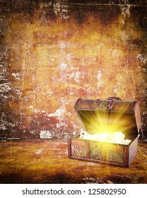 treasure chest with jewelry inside against grunge background