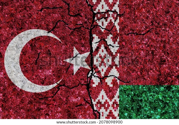 Turkey and Belarus painted flags on a wall with\
grunge texture. Turkey-Belarus conflict. Turkey and Belarus flags\
together