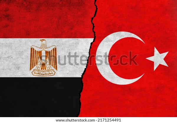 Turkey and\
Egypt painted flags on a wall with a crack. Egypt and Turkey\
relations. Turkey and Egypt flags\
together