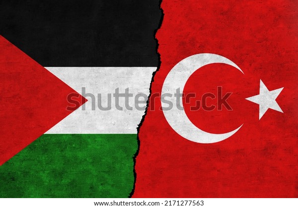 Turkey and Palestine painted flags on a wall\
with a crack. Palestine and Turkey relations.Turkey and Palestine\
flags together