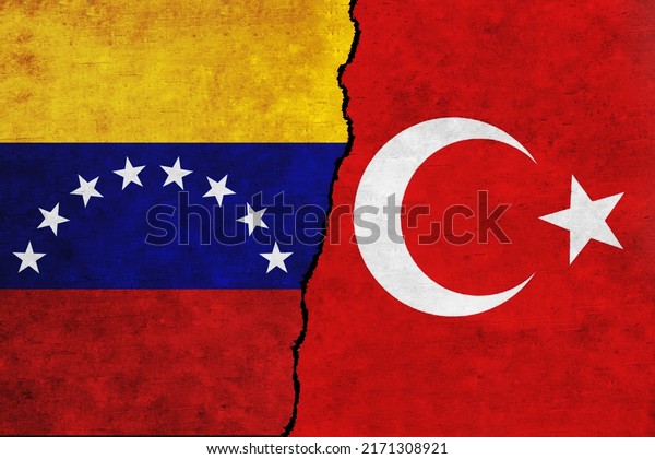 Turkey and Venezuela painted flags on a wall\
with a crack. Venezuela and Turkey relations.Turkey and Venezuela\
flags together