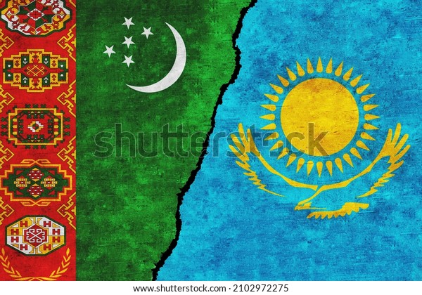 Turkmenistan and Kazakhstan painted flags on a\
wall with a crack. Turkmenistan and Kazakhstan relations.\
Kazakhstan and Turkmenistan flags\
together