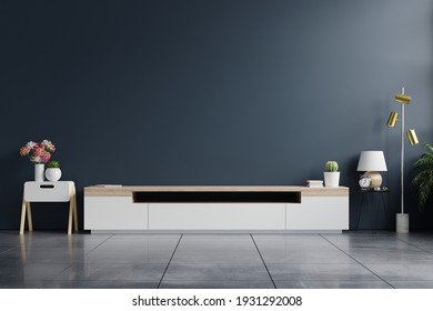 Tv Cabinet In Modern Empty Room With Behind The Dark Blue Wall.3d Rendering