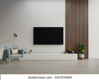 TV On The Cabinet In Modern Living Room With Armchair On White Dark Wall Background,3d Rendering