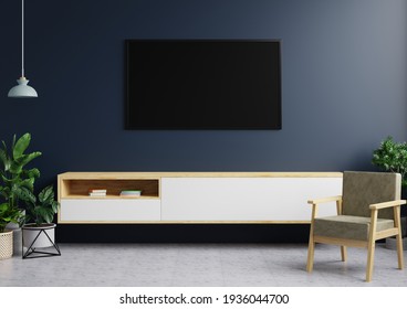 TV On The Dark Blue Walls In The Modern Living Room Features A Hanging Lamp, Plant Decorations And An Armchair On A Tiled Floor.3d Rendering