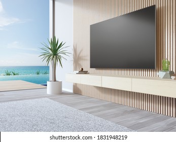 TV On Wooden Wall Of Living Room In Modern Beach House Or Luxury Pool Villa. White Home Interior 3d Rendering With Sea View.