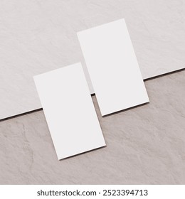 Two blank business cards on a neutral surface, perfect for showcasing business or personal branding with a simple, minimalist style. - Powered by Shutterstock