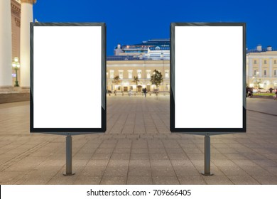 Two Blank Street Billboards At Night. Isolated With Clipping Path Around Advertising Display. 3d Illustration.