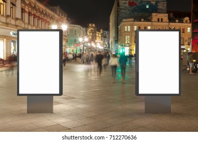 Two Blank Street Billboards At Night. Isolated With Clipping Path Around Advertising Display. 3d Illustration.