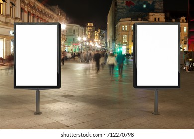 Two Blank Street Billboards At Night. Isolated With Clipping Path Around Advertising Display. 3d Illustration.