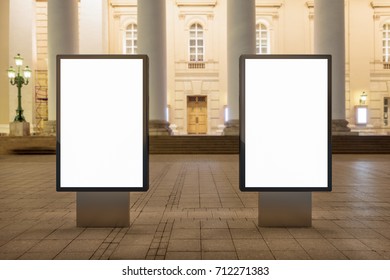 Two Blank Street Billboards At Night. Isolated With Clipping Path Around Advertising Display. 3d Illustration.