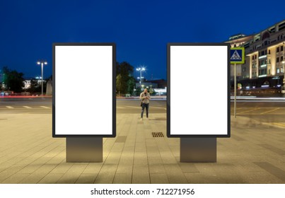 Two Blank Street Billboards At Night. Isolated With Clipping Path Around Advertising Display. 3d Illustration.