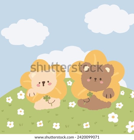 Two cute teddy bear sitting on the meadow.
